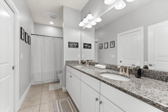 full bathroom featuring tile patterned floors, vanity, shower / tub combo, and toilet