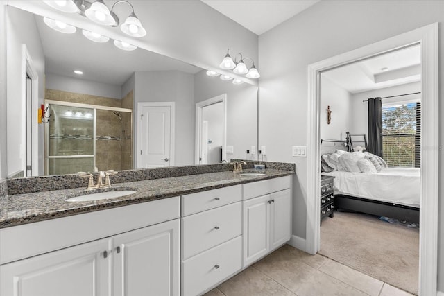 bathroom with vanity, tile patterned flooring, and walk in shower