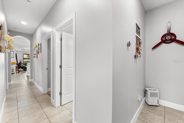 corridor featuring light tile patterned flooring