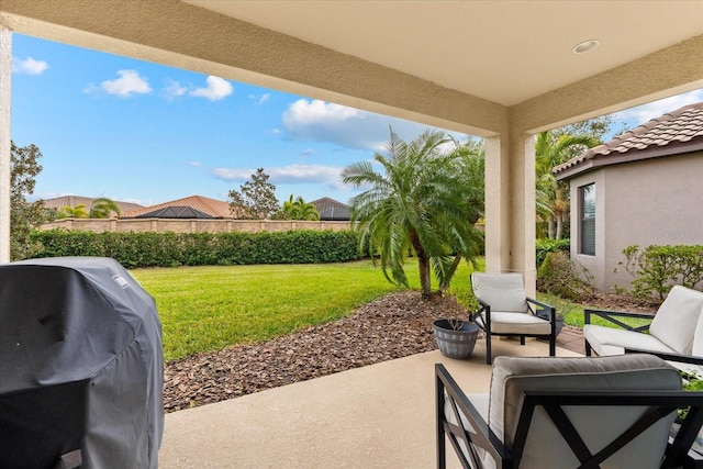 view of patio with grilling area and an outdoor hangout area