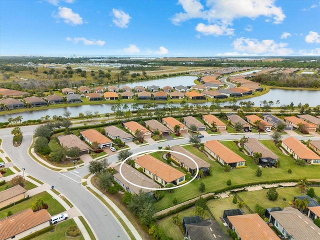 drone / aerial view with a water view