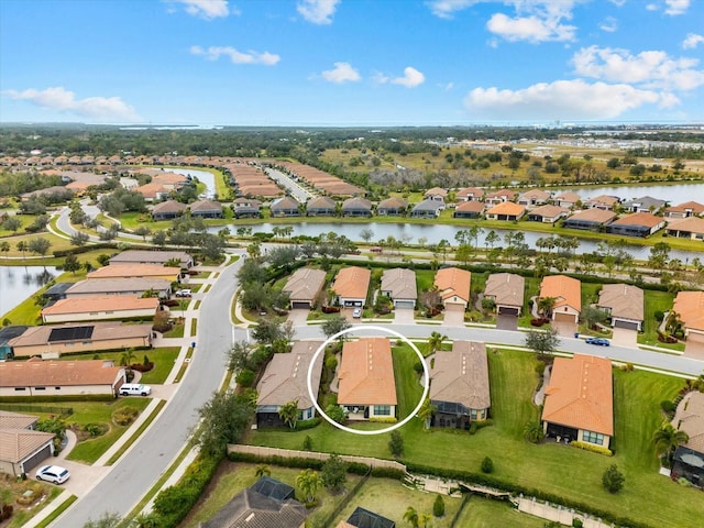 bird's eye view with a water view