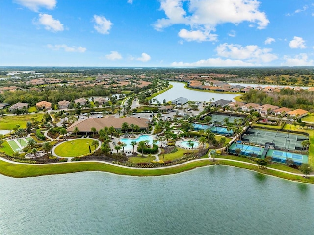 birds eye view of property with a water view