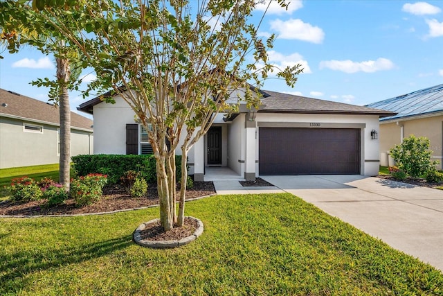 ranch-style house with a garage and a front yard