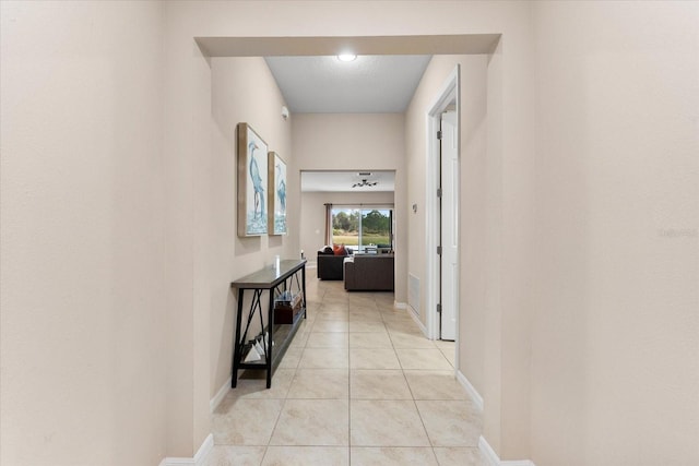 corridor with light tile patterned floors