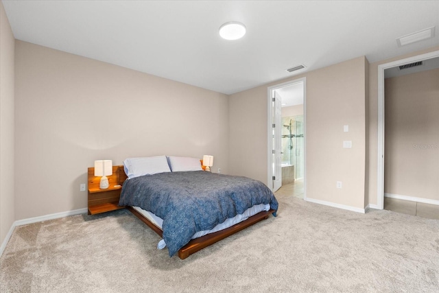 carpeted bedroom featuring connected bathroom