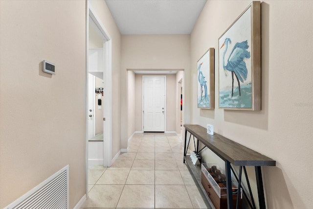 hallway with light tile patterned flooring