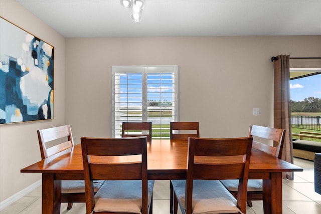 dining area featuring light tile patterned floors