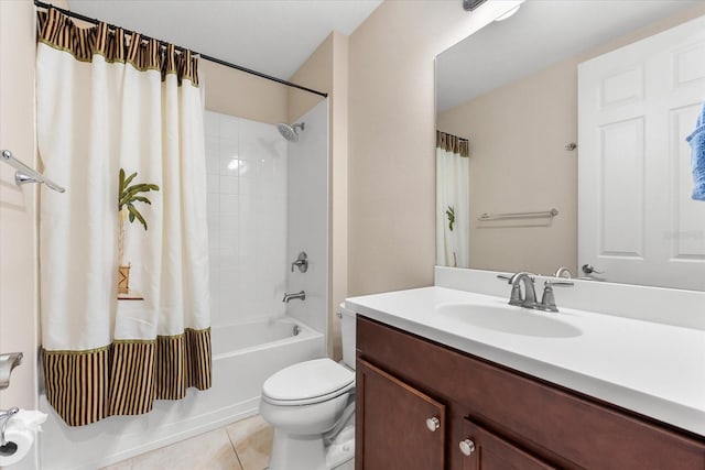 full bathroom with tile patterned floors, toilet, vanity, and shower / bath combo