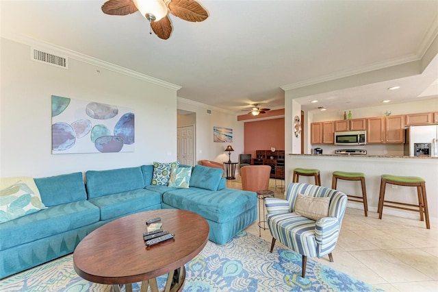 living room featuring light tile patterned floors and ornamental molding