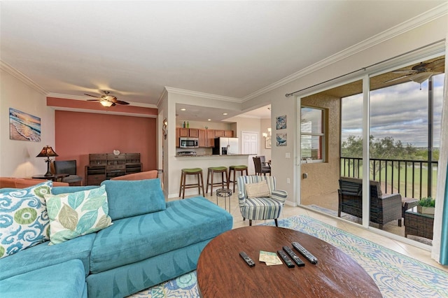 living room featuring ceiling fan, light tile patterned floors, and crown molding