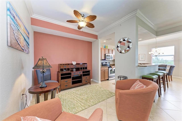 tiled living room with ceiling fan with notable chandelier and ornamental molding