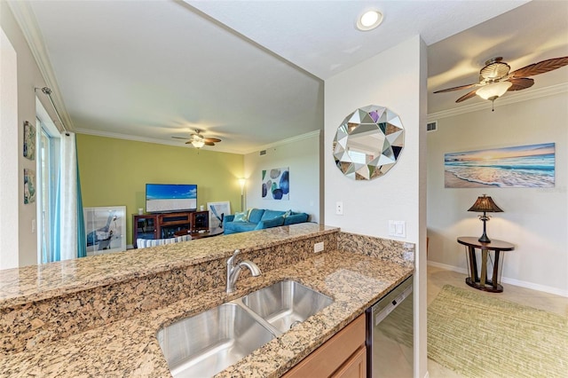 kitchen with dishwasher, light stone countertops, crown molding, and sink