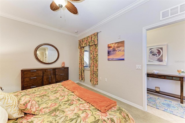 carpeted bedroom with ceiling fan and ornamental molding