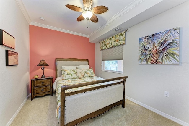 carpeted bedroom with ceiling fan and crown molding