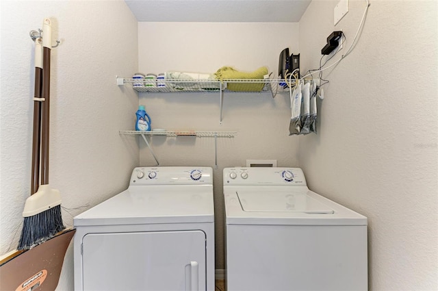 washroom with washer and clothes dryer