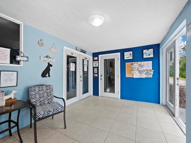 5645 Churchill Downs Rd, Sarasota, FL 34241 - sitting room with a textured ceiling and tile patterned flooring