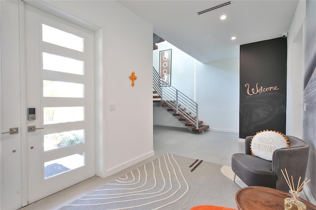 entryway featuring visible vents, stairway, a wealth of natural light, and recessed lighting