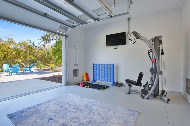 workout area with a garage