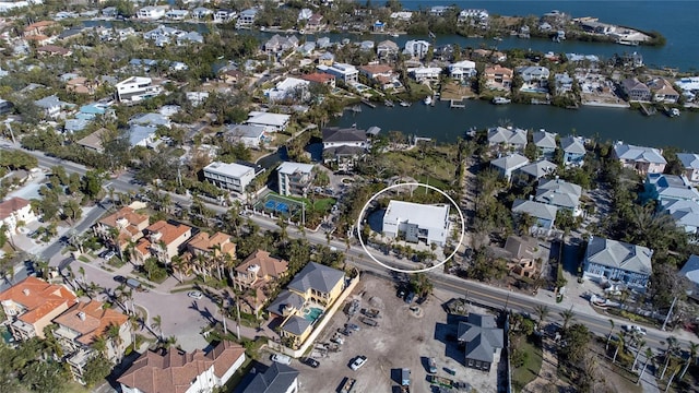 bird's eye view featuring a residential view and a water view