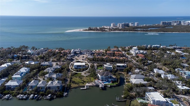 drone / aerial view with a water view