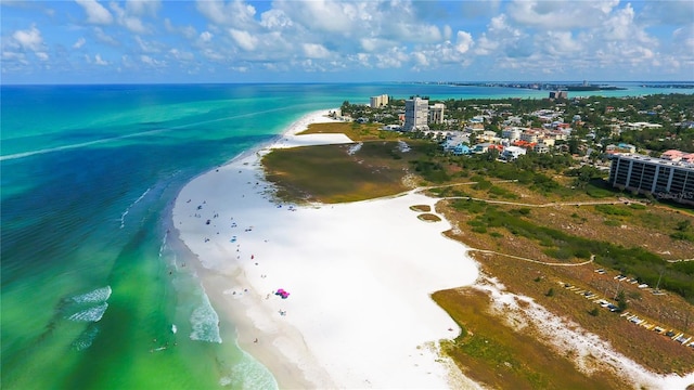 drone / aerial view with a beach view and a water view