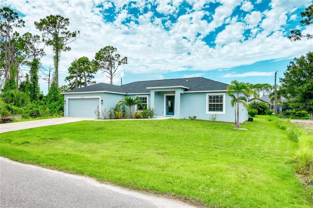 single story home featuring a garage and a front yard