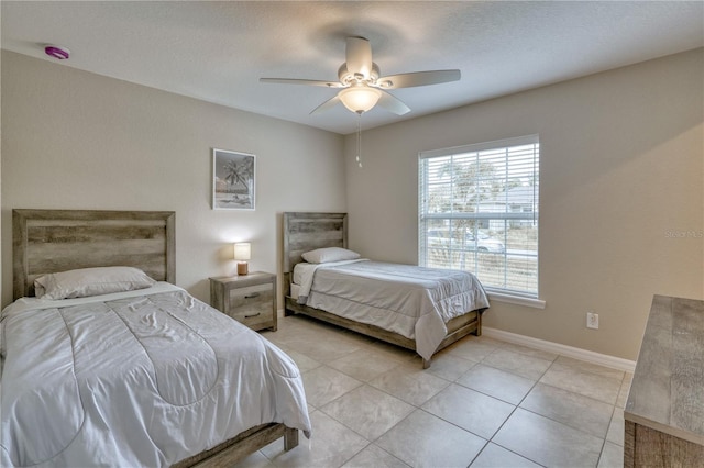 bedroom featuring ceiling fan and light tile patterned floors