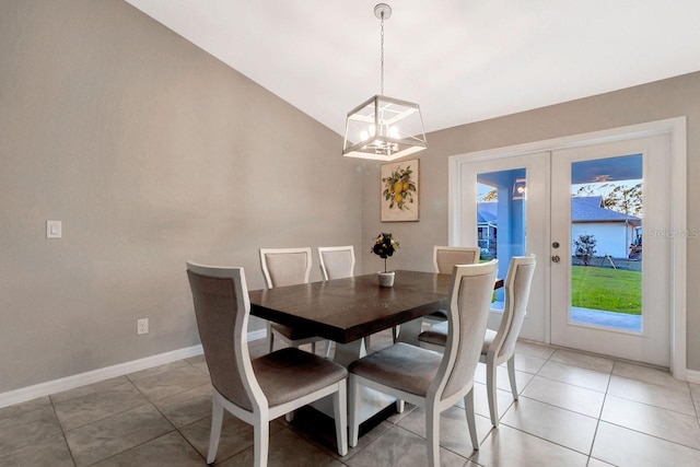 tiled dining space featuring french doors