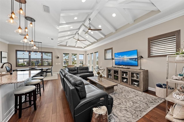 living room with ceiling fan, crown molding, sink, lofted ceiling with beams, and dark hardwood / wood-style floors