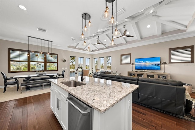 kitchen with a kitchen island with sink, sink, pendant lighting, dishwasher, and white cabinetry