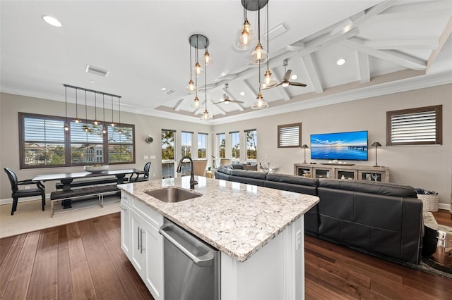 kitchen with white cabinetry, sink, dishwasher, hanging light fixtures, and a center island with sink