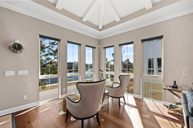 sitting room with beamed ceiling, light hardwood / wood-style floors, crown molding, and coffered ceiling