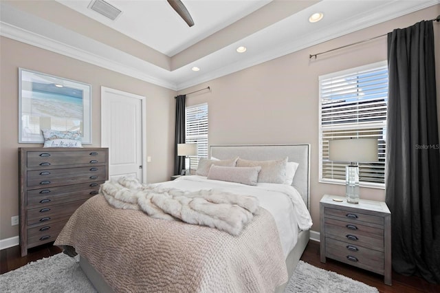 bedroom with ceiling fan and dark wood-type flooring