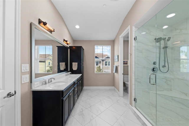 bathroom featuring a shower with door, vanity, lofted ceiling, and toilet