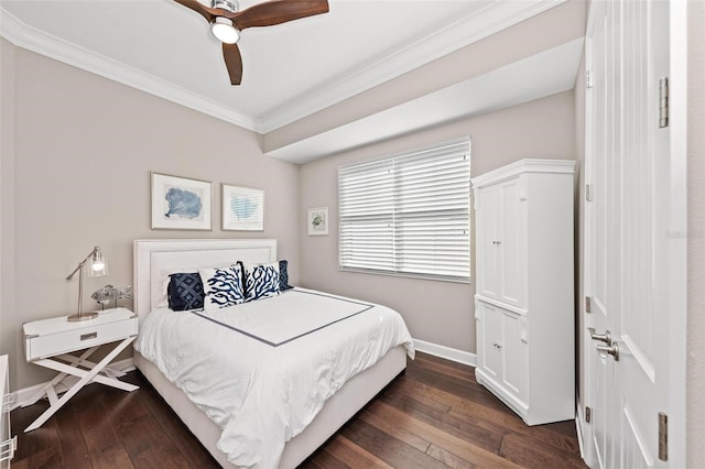 bedroom featuring ceiling fan, dark hardwood / wood-style flooring, and crown molding