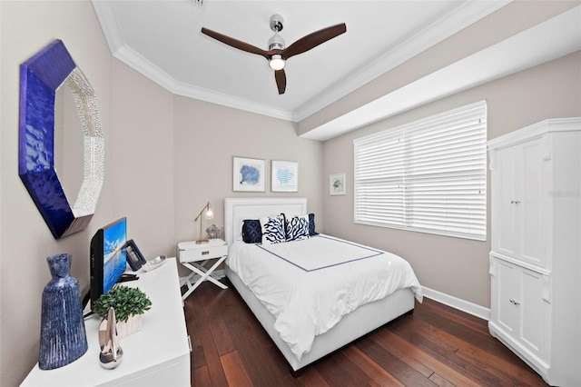 bedroom featuring dark hardwood / wood-style floors, ceiling fan, and crown molding