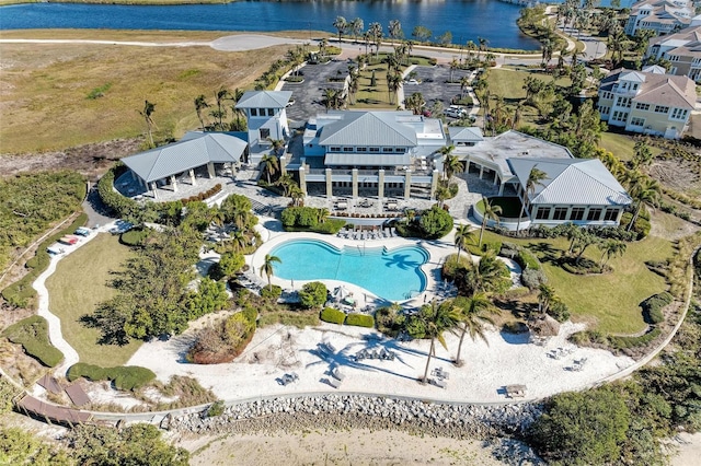 birds eye view of property with a water view