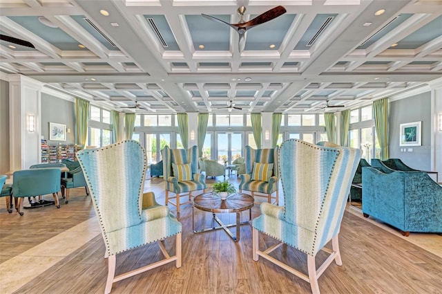 sunroom / solarium featuring ceiling fan, french doors, and coffered ceiling