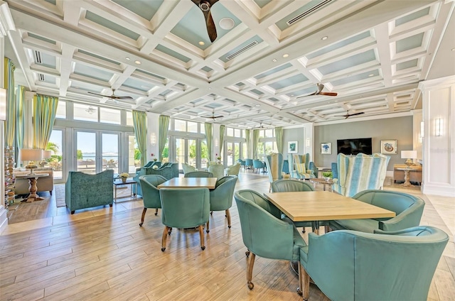 sunroom with beamed ceiling, ceiling fan, french doors, and coffered ceiling