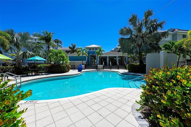 view of swimming pool featuring a patio area