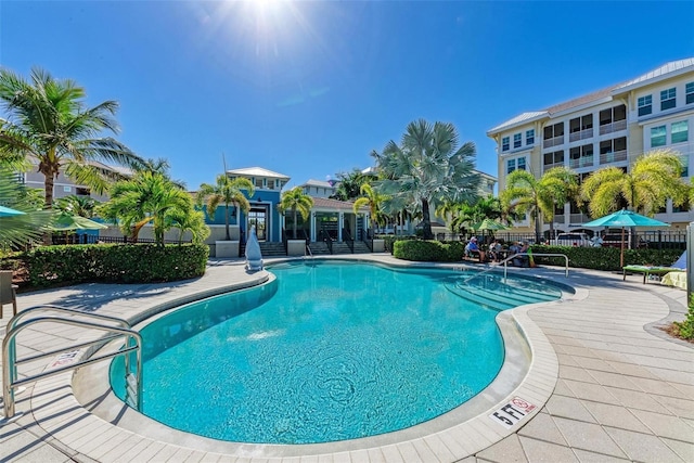 view of swimming pool with a patio