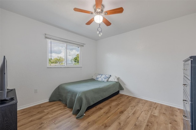 bedroom featuring light hardwood / wood-style flooring and ceiling fan