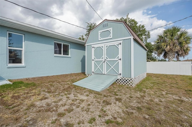 view of outbuilding with a lawn