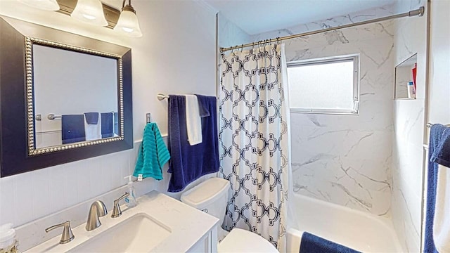 full bathroom featuring vanity, shower / bath combination with curtain, and toilet