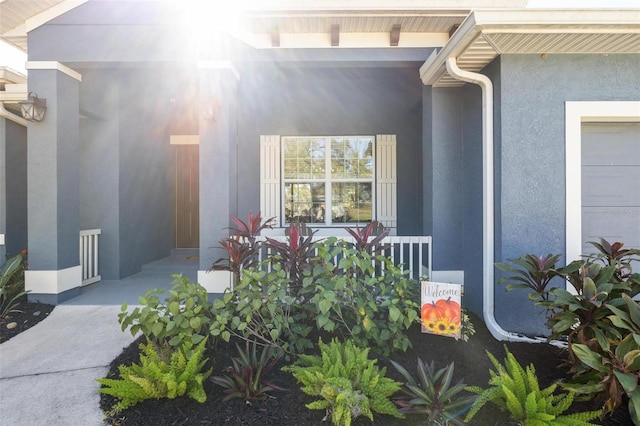 doorway to property featuring a garage