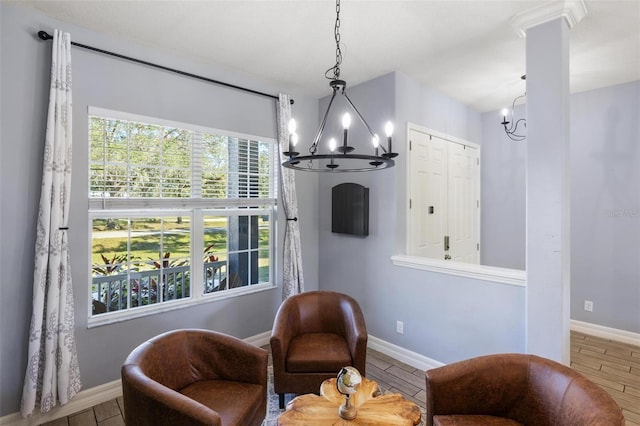 living area featuring a chandelier and plenty of natural light