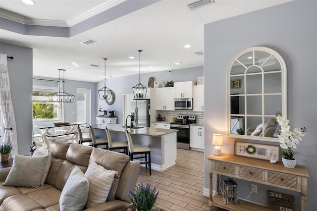 living room featuring crown molding