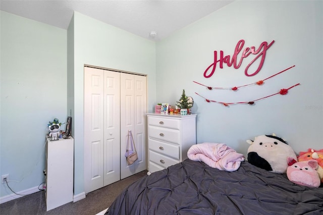 bedroom featuring dark colored carpet and a closet