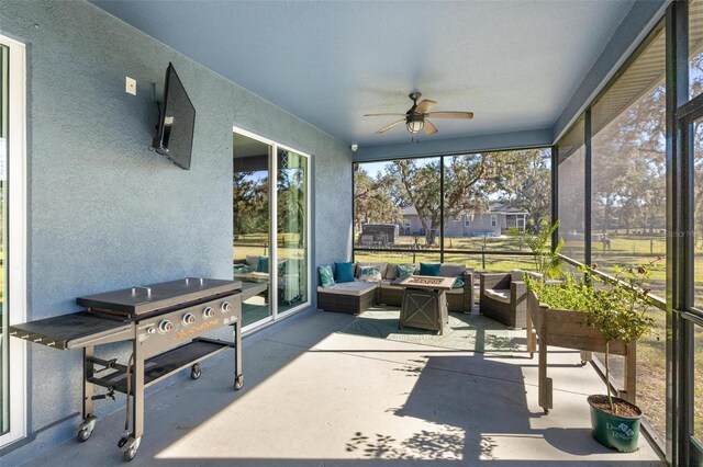 sunroom / solarium with ceiling fan